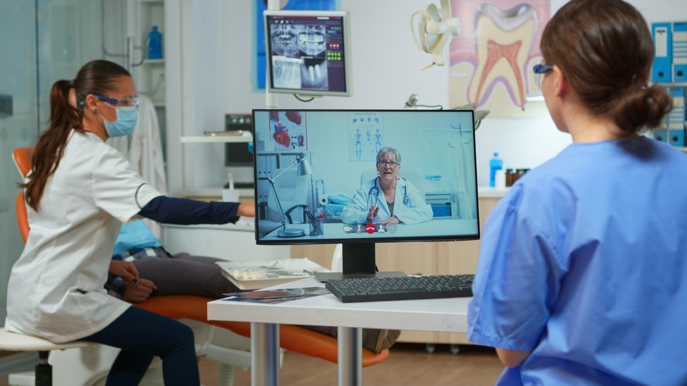 Clinicians on a video consultation with a remote physician